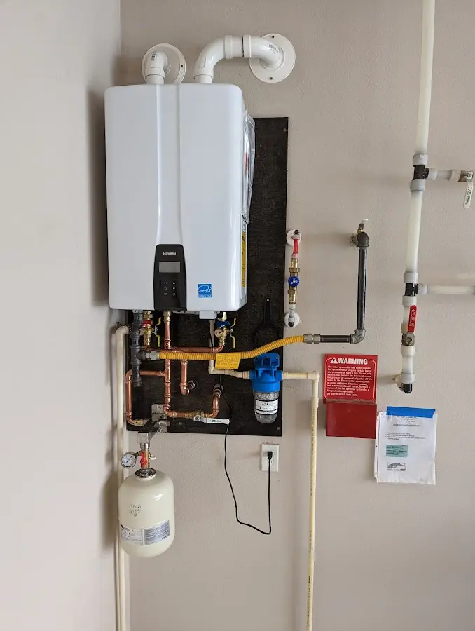 Professional plumber installing copper piping in a Aledo home